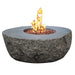 elementi boulder rock fire pit table ofg110 with flame on white background. fire pit is lit on red lava rocks