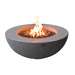 light grey round fire pit table with fire pit lit on brown lava rocks in the middle