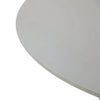 A tightly cropped, top-down view shows a portion of a round, light grey surface of an elementi home outdoor dining table