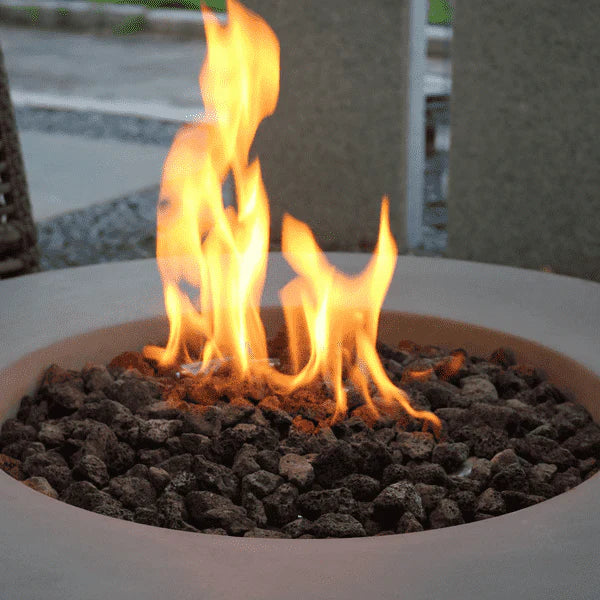 close up of fire burning on round fire pit table