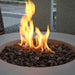 close up of fire burning on round fire pit table