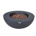 dark grey round fire pit table with brown lava rocks in the middle but fire pit is not lit