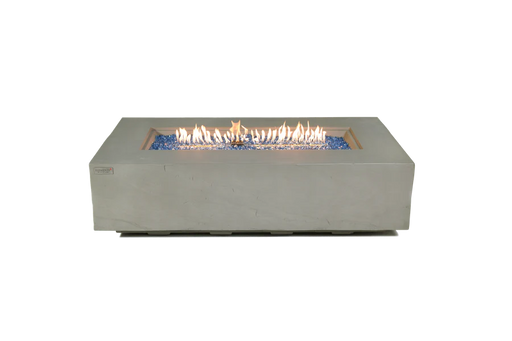 sandstone rectangular fire pit table is lit on blue fire glass