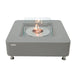 space grey square fire pit table with square glass windscreen with fire pit lit in middle of fire table