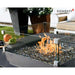 glass windscreen on black square fire pit table that is burning on fire glass