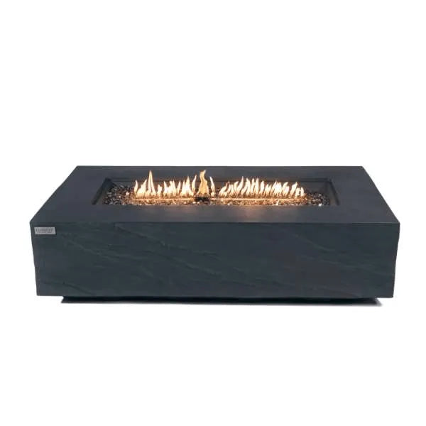 Image of a low, rectangular black fire pit table with a glass wind guard and lit flames in the center.