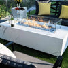 white rectangle fire pit table with glass guard with wine bottle on fire table