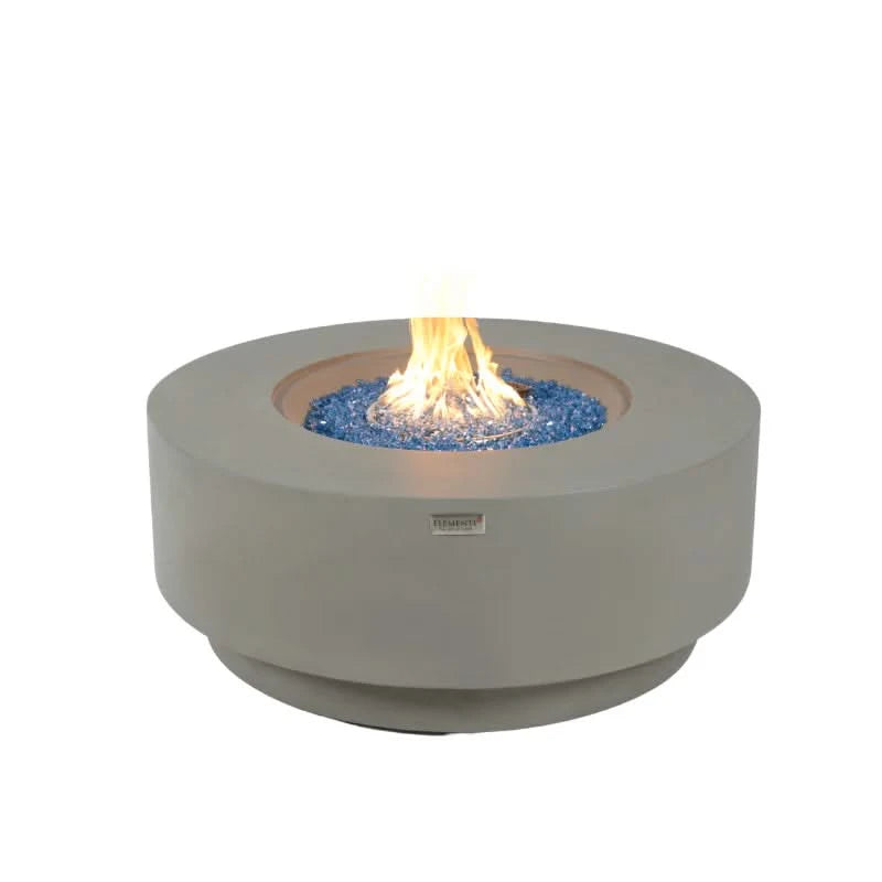 elementi plus Colosseo round propane fire pit table burning on blue fire glass on a white background