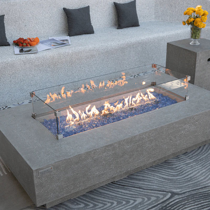 rectangle fire pit table with glass guard different angle. fire pit it burning on blue fire glass