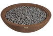 Round terracotta fire pit with gray stones inside on a white background