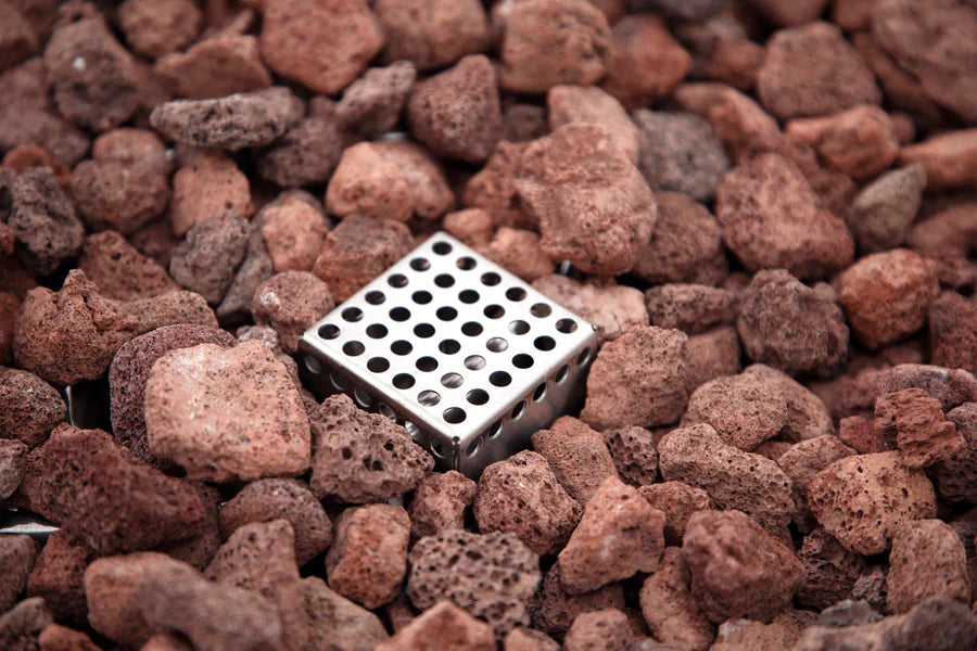 Metallic grid embedded in red-brown decorative stones