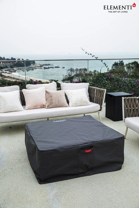 square fire pit table with grey cover on balcony deck