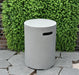 elementi round cast concrete tank cover in light grey outside in patio