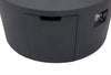 Close-up of a dark gray fire pit table showing a small door with a handle and a control panel with knobs on the side.