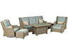  A 8-piece outdoor seating set with a rectangular fire pit table. The set includes a sofa, two swivel armchairs, two ottomans, and two side tables. The fire pit table has a square shape and a glass top. The cushions are light blue and the frame is brown.