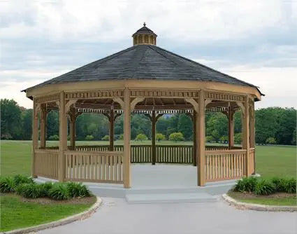 A large, 22inch dodecagon gazebo with a cupola, surrounded by a wooden railing and a lush green lawn