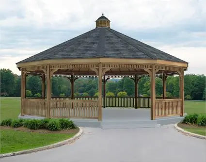 A large single roof dodecagon gazebo with a cupola, surrounded by a wooden railing and a lush green lawn