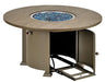 A round gas fire pit table with a wooden top and a bronze-colored base. The fire pit has blue flames and glass fire beads. A door on the side of the base is open, revealing a storage compartment.