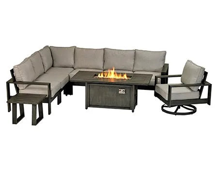  A 9-piece outdoor sectional seating set with a rectangular fire table in the center. The set includes a large L-shaped sectional sofa, two armchairs, a swivel chair, and two square accent tables. The fire table has a gray finish and a glass top with flames visible. The cushions are beige and the frame is dark gray.