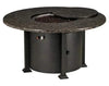  A round fire pit table with a granite top and a black metal base. The table has a circular burner and a control panel with a knob and a switch. A granite lid covers the burner, and a door on the side of the base reveals a storage compartment.