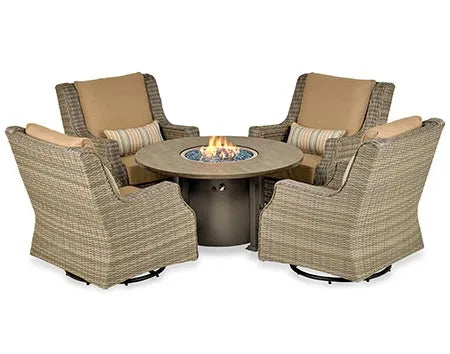 A patio furniture set consisting of a round fire pit table and four swivel chairs. The table has a wooden top and a bronze-colored base. The fire pit features blue flames and glass fire beads. The chairs have wicker frames and beige cushions.