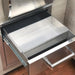 A stainless steel drawer is open, revealing a stainless steel tray inside. The drawer and tray have sleek, modern handles.