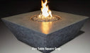 gfrc grey square fire pit table with round fire pit burning on vesper black fire glass on a back background