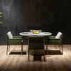 A slightly elevated, full shot captures a modern outdoor dining set arranged on a light brown wooden deck. 