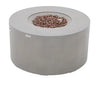 A gray, cylindrical gas fire pit with brown lava rocks in the center.
