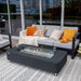 rectangular fire pit table on top of rug in outdoor patio