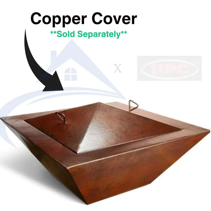 Hand-hammered copper gas fire bowl with oil-rubbed finish and a square base. Water feature is visible in the base of the fire pit.