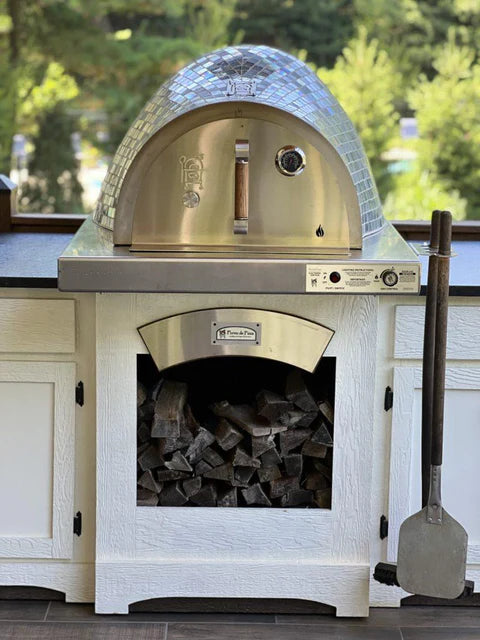 Close-up image of a brochure showcasing the HPC Villa Series Built-In Outdoor Pizza Oven. The stainless steel oven features a sleek glass tile front and sits on a stainless steel countertop.