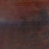  A close up of copper material on a fire pit lid.