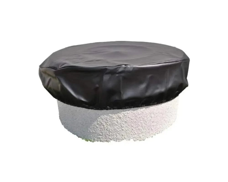 A black, round HPC Round Vinyl Fire Pit Cover 35 sits on a table. White text on the cover reads "HPC Fire Pit Cover" and "HPC Round Vinyl Fire Pit Cover 35". The background is blurry.