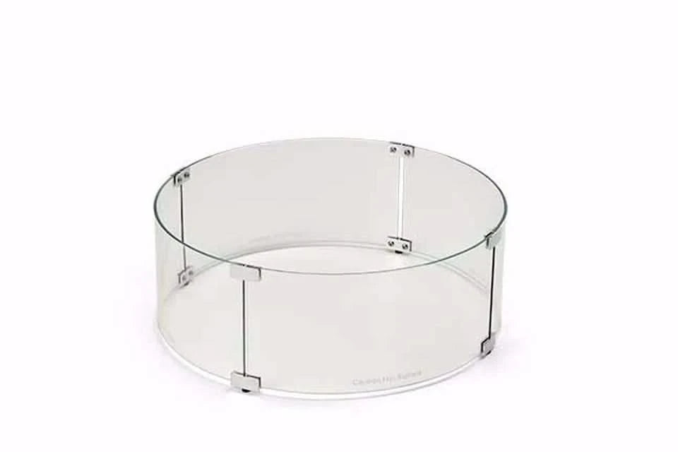 Round glass wind guard for fire pits. The guard is made of clear tempered glass and has a polished aluminum frame. It is designed to protect the fire from wind and debris. The guard is easy to install and remove.