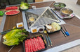 food set out on an outdoor bbq grill table