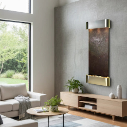 Modern living room with a indoor wall mounted water feature on a stone, with sofa, and coffee table decorated next to it 