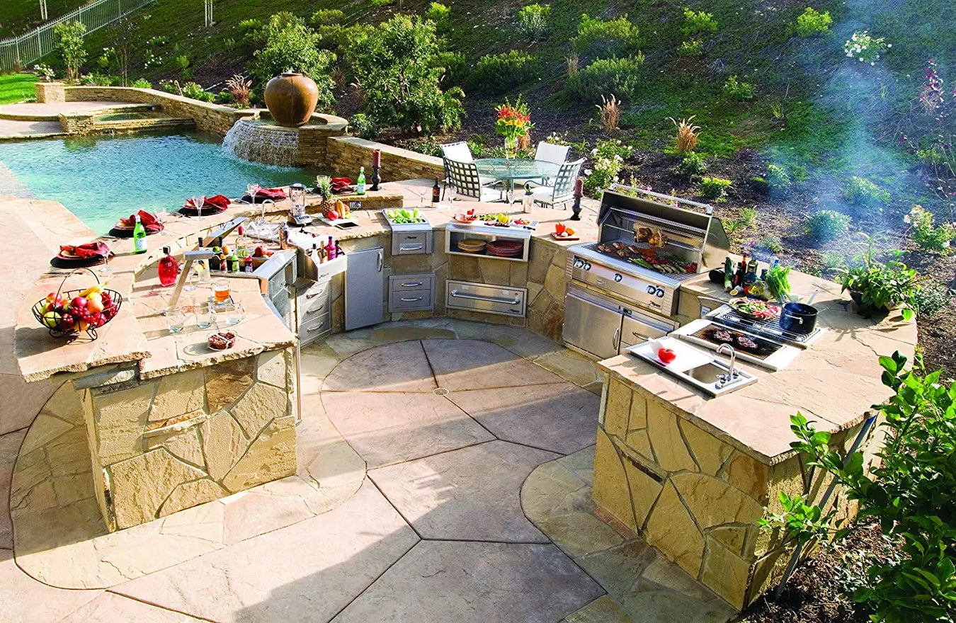 Estate Kitchen setting with masonry islands and integrated outdoor cooking setups