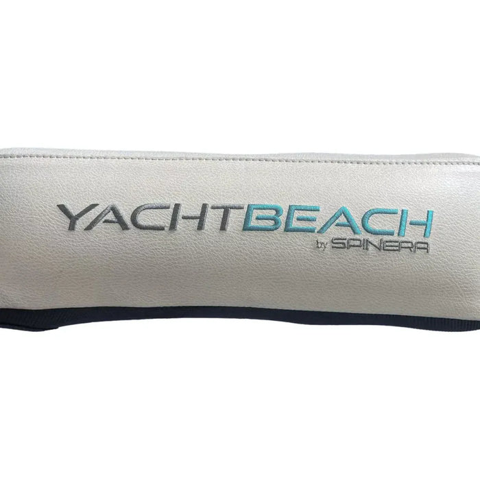 White pillow with 'YACHT BEACH by Spinera' branding on a white background