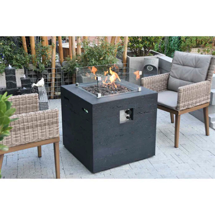 modeno ellington slate black square fire pit table OFG302 on a patio in between luxury outdoor furniture