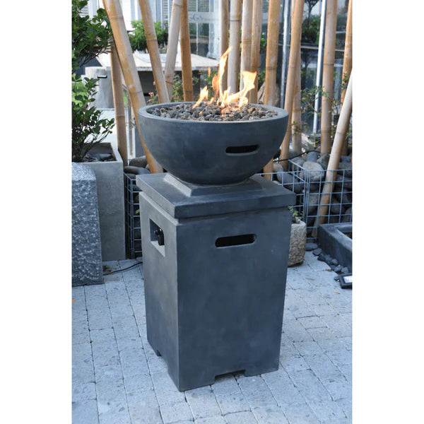 grey fire column with round fire pit. fire pit is lit on lava rocks