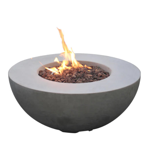 light grey round fire pit table is lit and burning on lava rocks on a white background