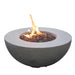 light grey round fire pit table is lit and burning on lava rocks on a white background