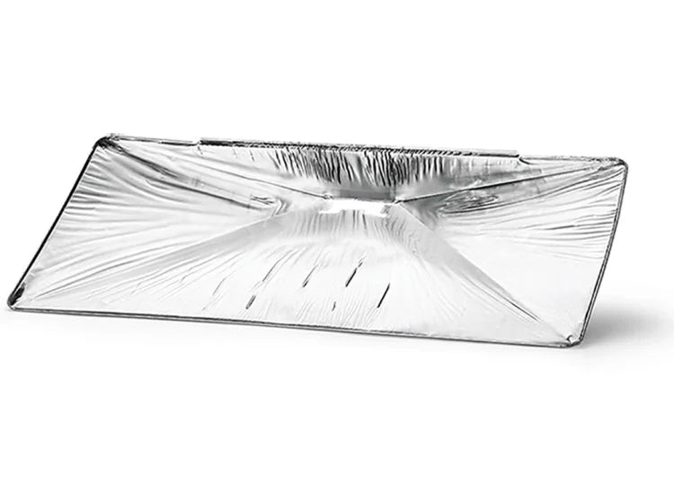 A silver aluminum foil drip pan liner with a raised center section and perforations for drainage by napoleon grills