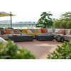 Two black Elementi Colorado rectangular outdoor coffee tables on a wooden patio with outdoor seating.