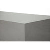 A detailed view of the corner of a grey, rectangular coffee table, likely the Elementi Colorado GRC Medium Coffee Table, showing its smooth surface.