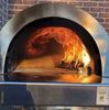Freestanding, dual-fuel outdoor pizza oven cart with a mosaic tile façade on a black powder-coated steel cart with storage shelf. Caster wheels provide easy mobility.