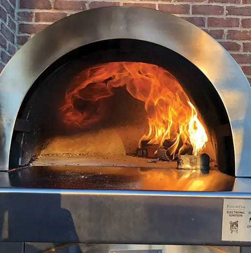 Freestanding, dual-fuel outdoor pizza oven cart with a mosaic tile façade on a black powder-coated steel cart with storage shelf. Caster wheels provide easy mobility.