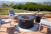 Fire pit with lava rocks, patio setting, and "ELEMENTI" branding.