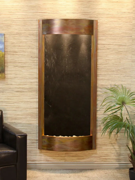 Black Featherstone and rustic copper Adagio Pacifica Waters water fountain mounted on a wall.